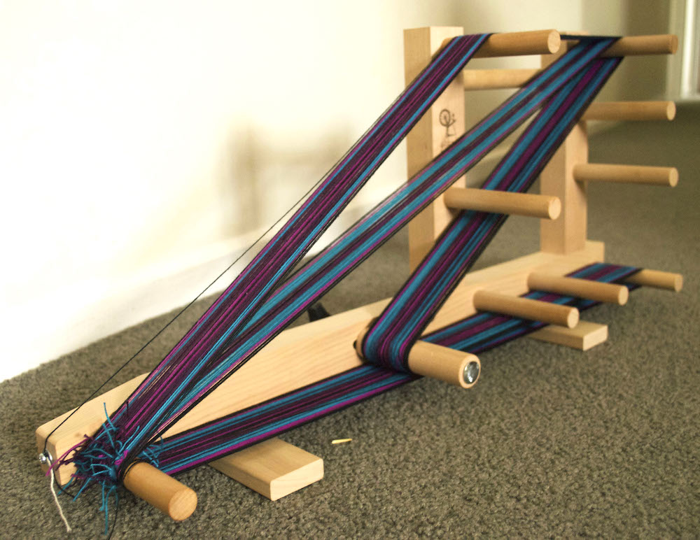 My dad helped me build this awesome inkle loom! I'm new to weaving